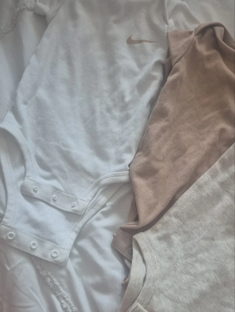 Nike Kids One-Piece Bodysuits in White, Beige, and Tan - Trio Pack